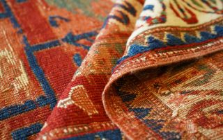 Close-up detail showing the hand-knotted rugs