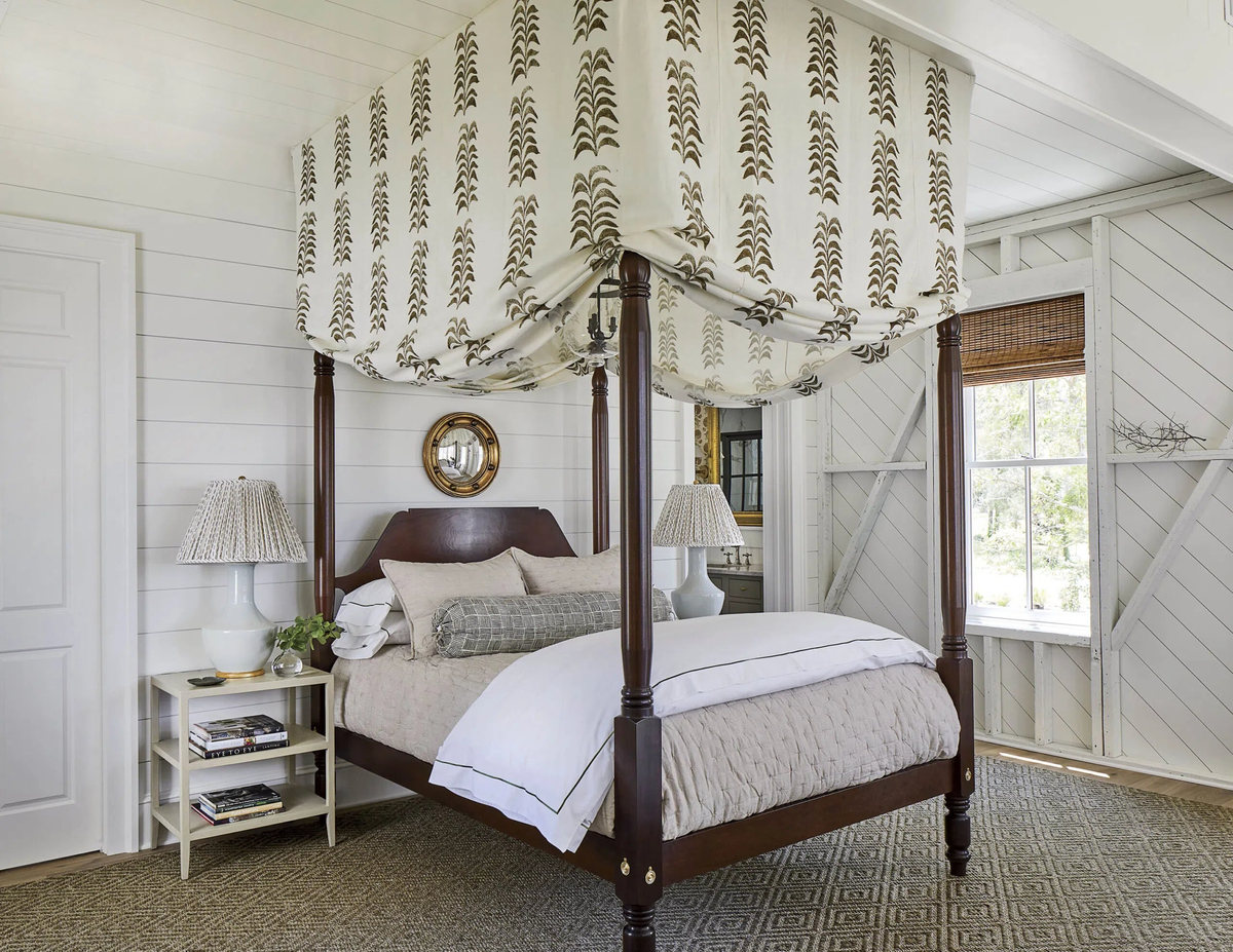 bakari-oat-straw-sisal-bedroom-1200 Bakari diamond-pattern sisal rug beneath a dark wood canopy bed.