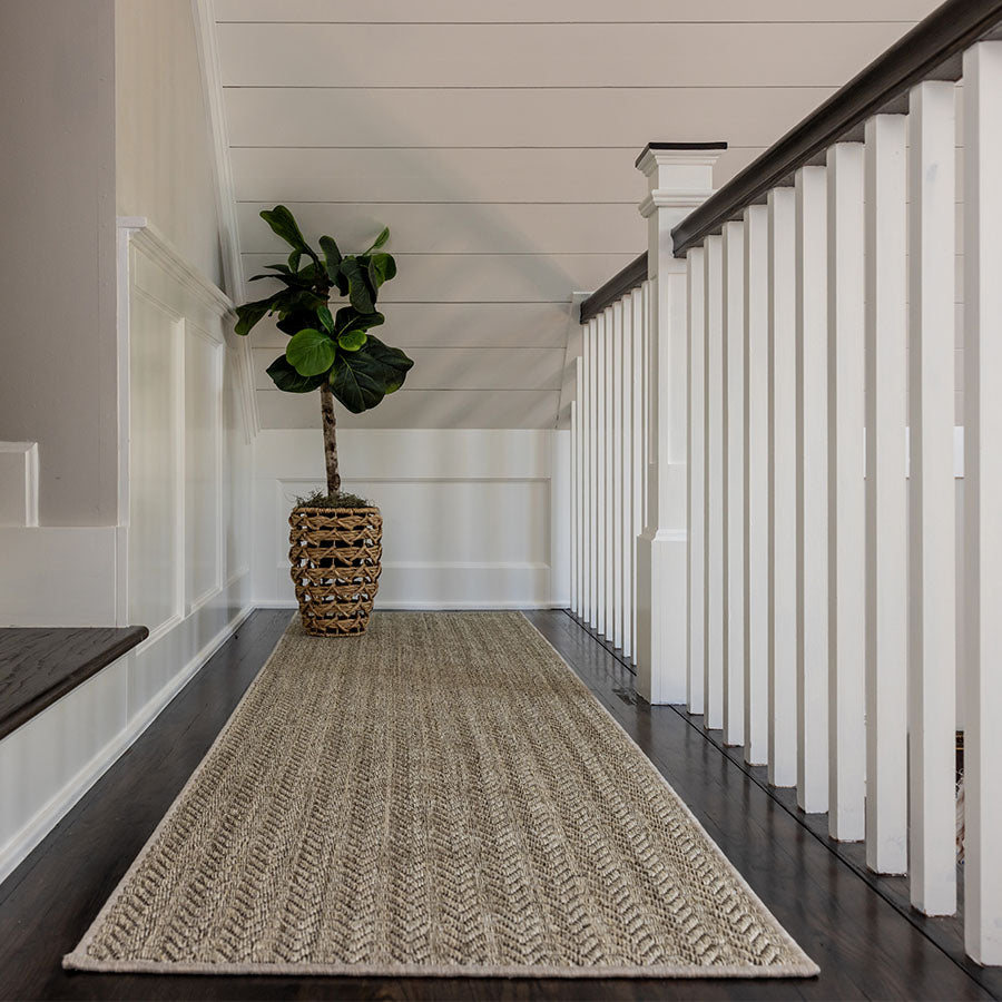 odyssey-hidden-cove-sisal-runner-900 Odyssey sisal runner with a wave-like pattern in a bright hallway.